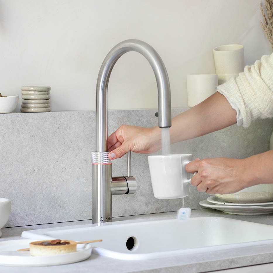 Filling a mug with boiling water from a stainless steel Quooker Flex